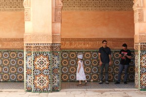 family observing tile work Marrakesh